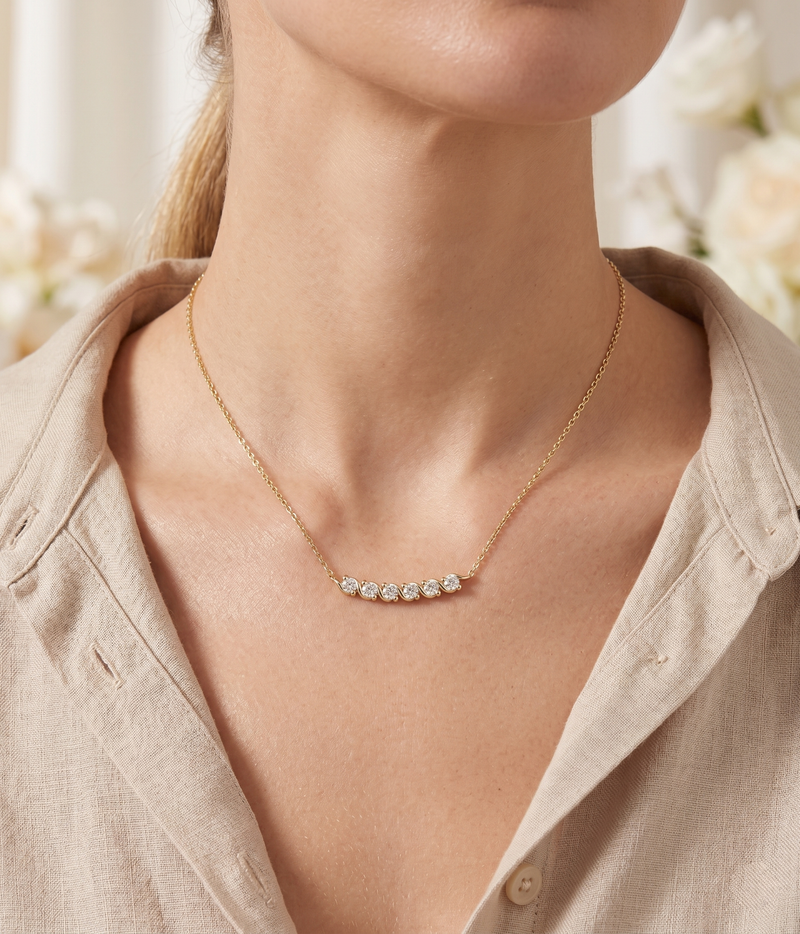 lumina forge eternal wave moissanite necklace in yellow gold finish — model view