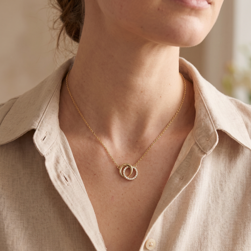 lumina forge eternal interlock moissanite necklace in yellow gold finish — model view