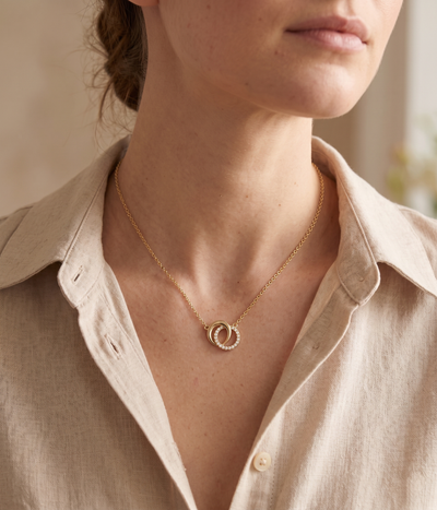 lumina forge eternal interlock moissanite necklace in yellow gold finish — model view