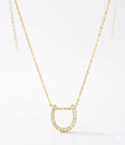lumina forge lucky horseshoe moissanite necklace in yellow gold finish — front view