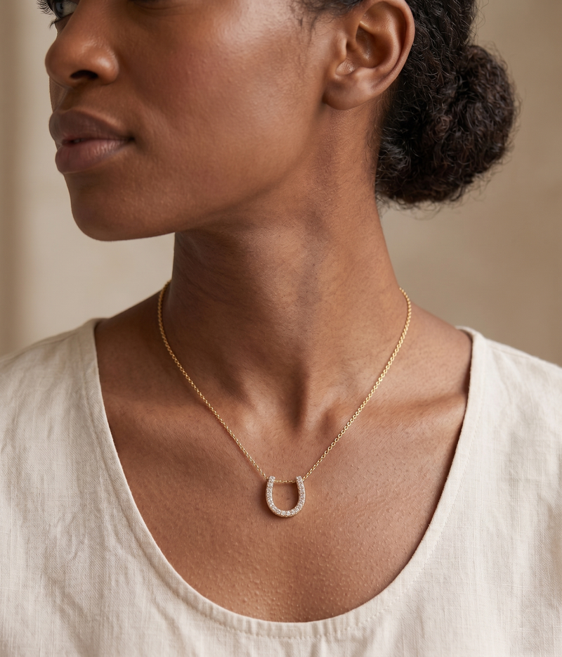 lumina forge lucky horseshoe moissanite necklace in yellow gold finish — model view