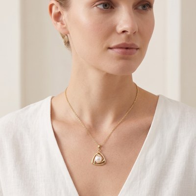 lumina pearl triangle pendant necklace in yellow gold finish — model view