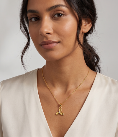 triple petal pendant necklace in yellow gold finish — model view