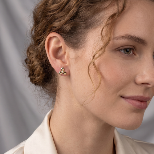 triple petal stud earrings in yellow gold finish — model view