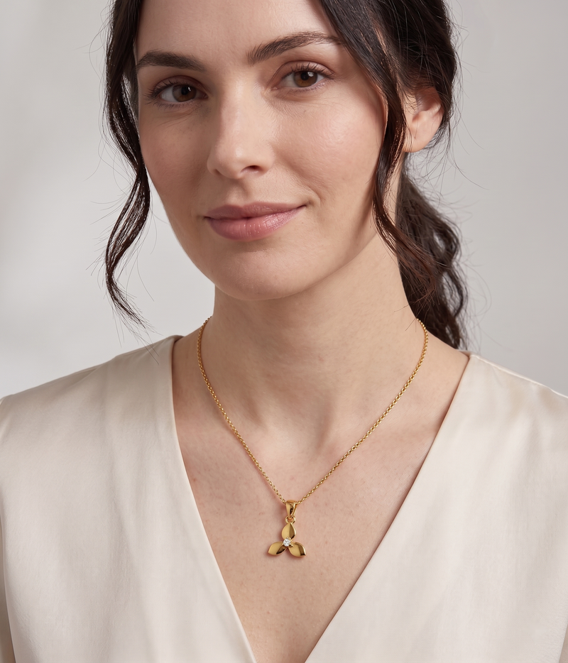 triple petal pendant necklace in yellow gold finish — model view
