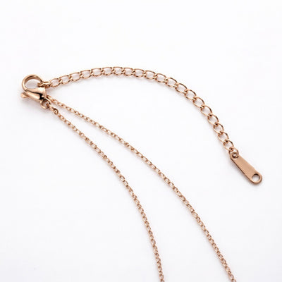 garnet birthstone necklace in rose gold finish — back view