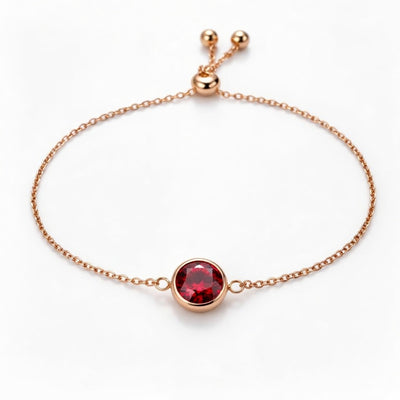 garnet birthstone bracelet in rose gold finish — front view