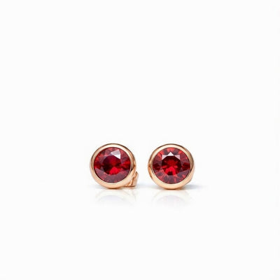 garnet birthstone stud earrings in rose gold finish — front view