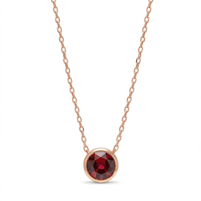 garnet birthstone necklace in rose gold finish — front view