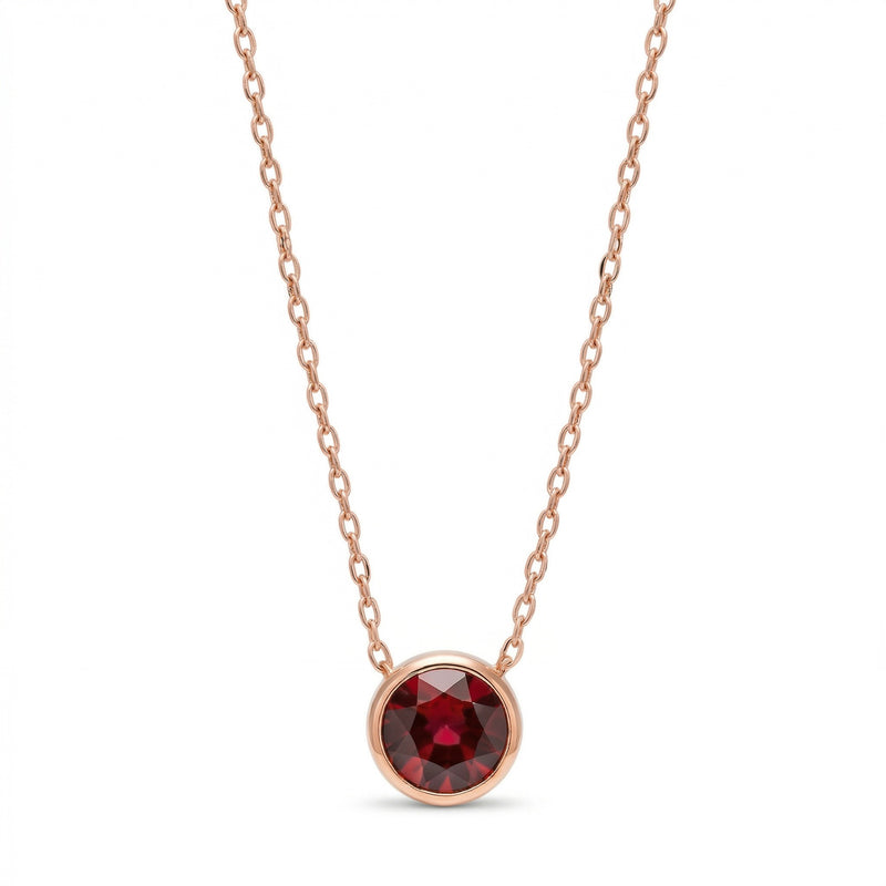 garnet birthstone necklace in rose gold finish — front view
