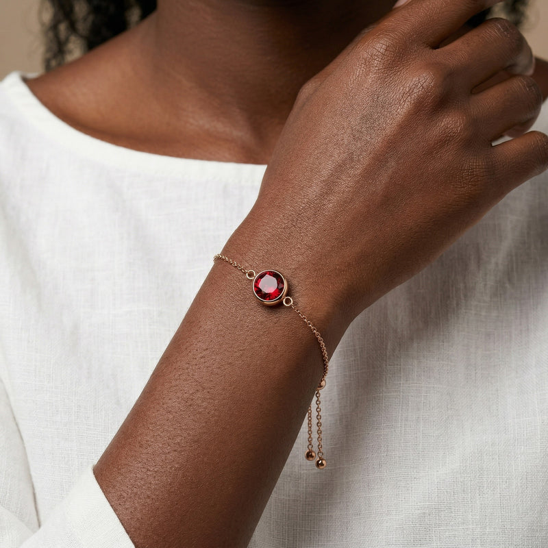 garnet birthstone bracelet in rose gold finish — model view