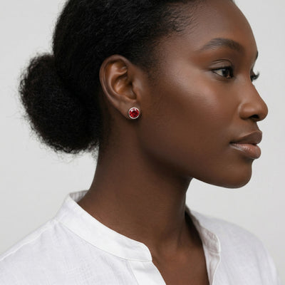 garnet birthstone stud earrings in white gold finish — model view