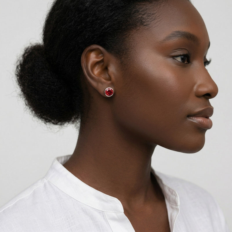 garnet birthstone stud earrings in white gold finish — model view
