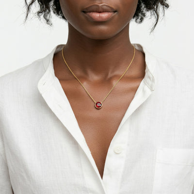 garnet birthstone necklace in yellow gold finish — model view