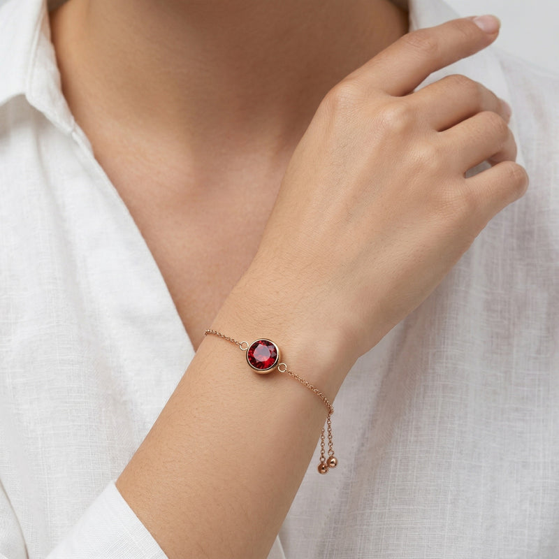 garnet birthstone bracelet in rose gold finish — model view
