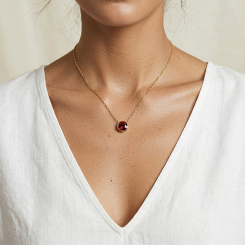 garnet birthstone necklace in yellow gold finish — model view