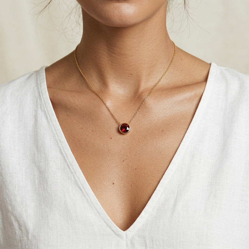 garnet birthstone necklace in yellow gold finish — model view