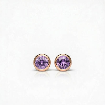 amethyst birthstone stud earrings in rose gold finish — front view