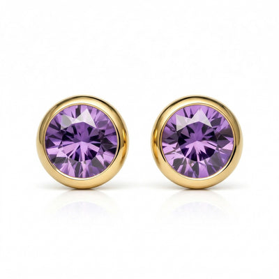 amethyst birthstone stud earrings in yellow gold finish — front view