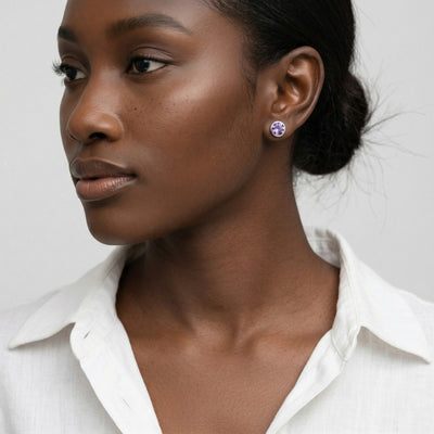 amethyst birthstone stud earrings in white gold finish — model view