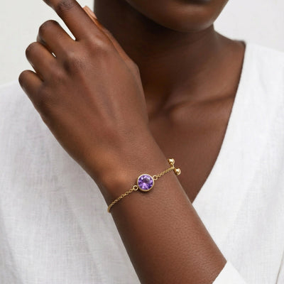 amethyst birthstone bracelet in yellow gold finish — model view