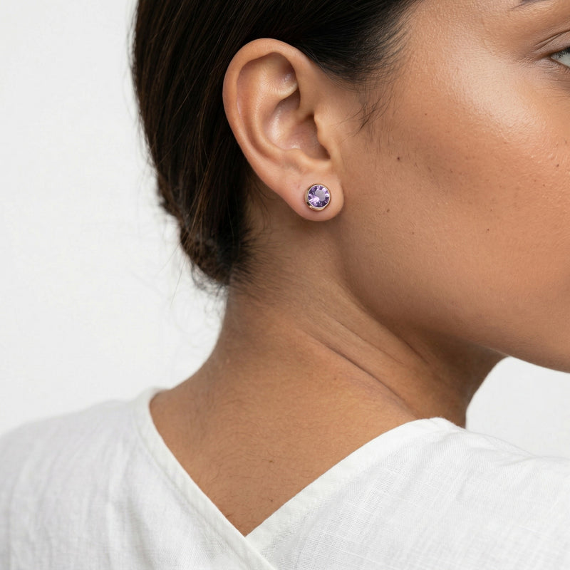 amethyst birthstone stud earrings in rose gold finish — model view