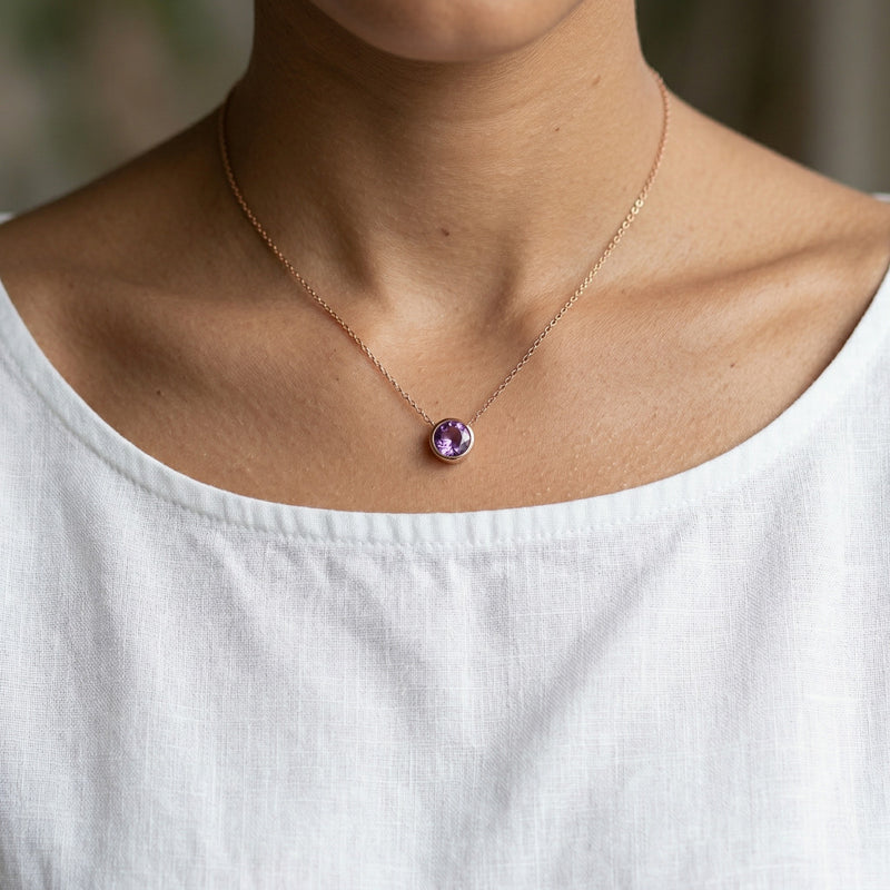 amethyst birthstone necklace in rose gold finish — model view