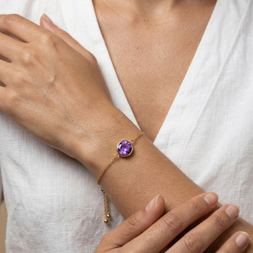amethyst birthstone bracelet in yellow gold finish — model view