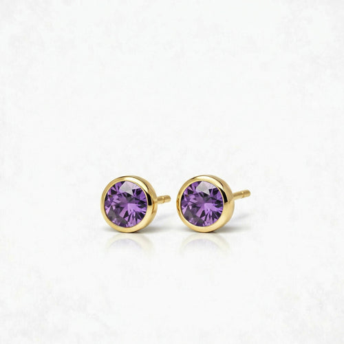 amethyst birthstone stud earrings in yellow gold finish — side view
