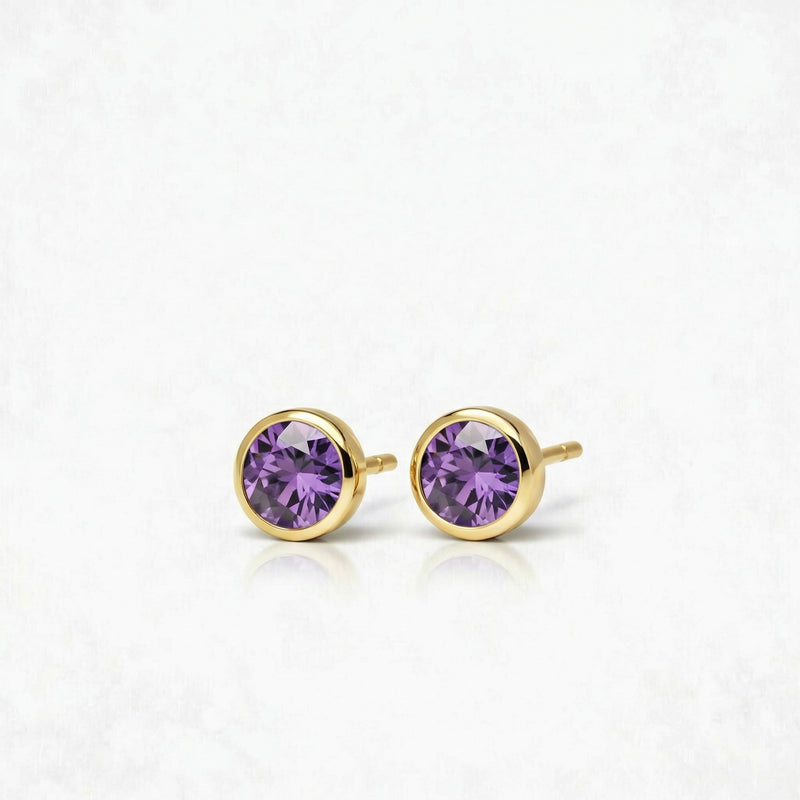 amethyst birthstone stud earrings in yellow gold finish — side view