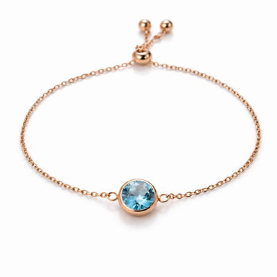 aquamarine birthstone bracelet in rose gold finish — front view