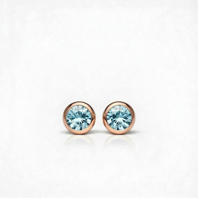 aquamarine birthstone stud earrings in rose gold finish — front view