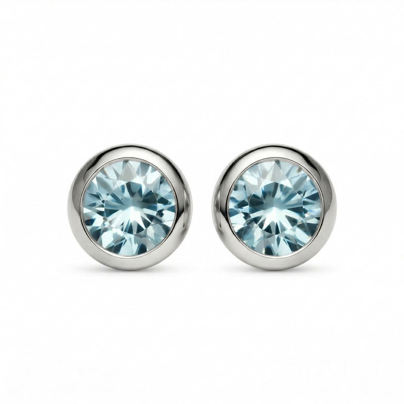 aquamarine birthstone stud earrings in white gold finish — front view