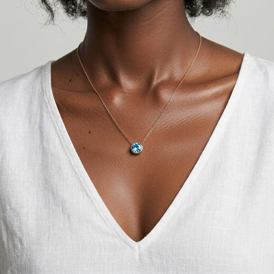 aquamarine birthstone necklace in rose gold finish — model view
