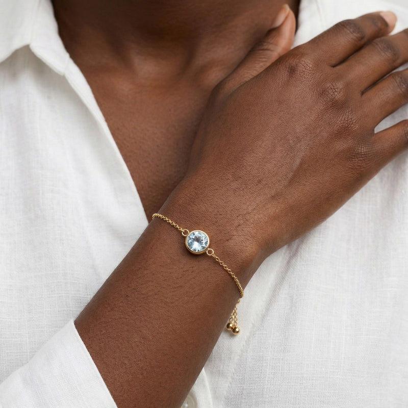 aquamarine birthstone bracelet in yellow gold finish — model view
