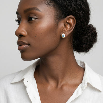 aquamarine birthstone stud earrings in yellow gold finish — model view