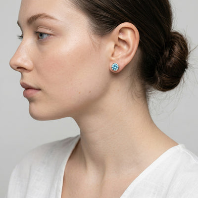 aquamarine birthstone stud earrings in rose gold finish — model view