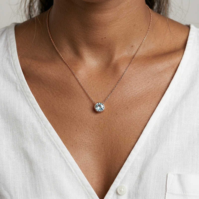 aquamarine birthstone necklace in rose gold finish — model view