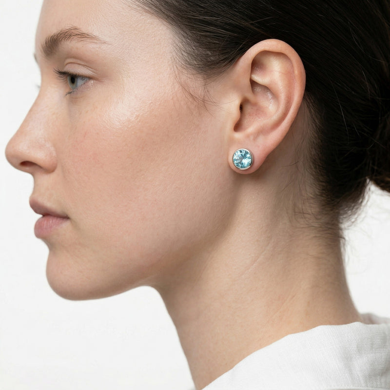 aquamarine birthstone stud earrings in white gold finish — model view