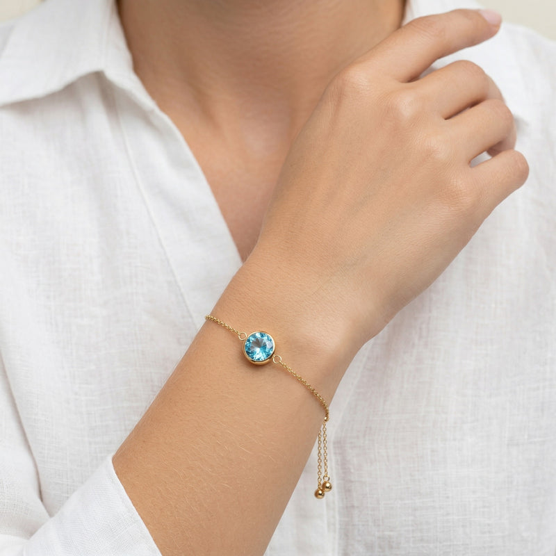 aquamarine birthstone bracelet in yellow gold finish — model view