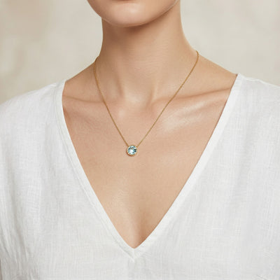 aquamarine birthstone necklace in yellow gold finish — model view