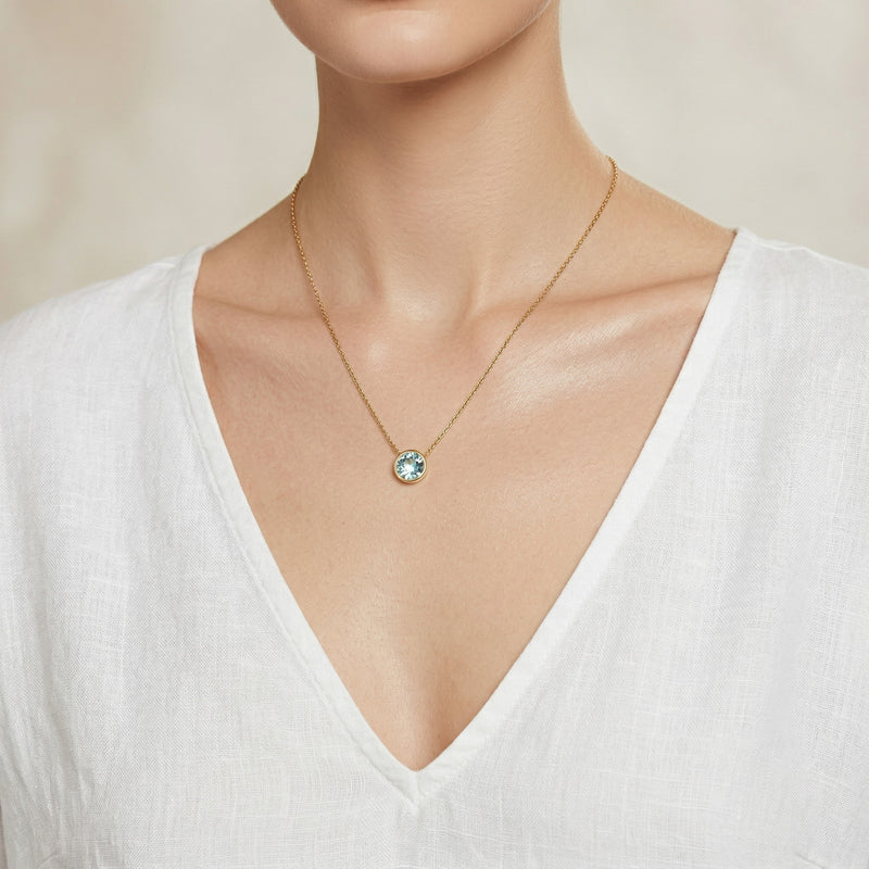 aquamarine birthstone necklace in yellow gold finish — model view