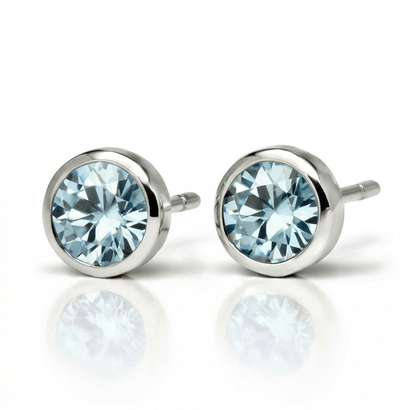 aquamarine birthstone stud earrings in white gold finish — side view