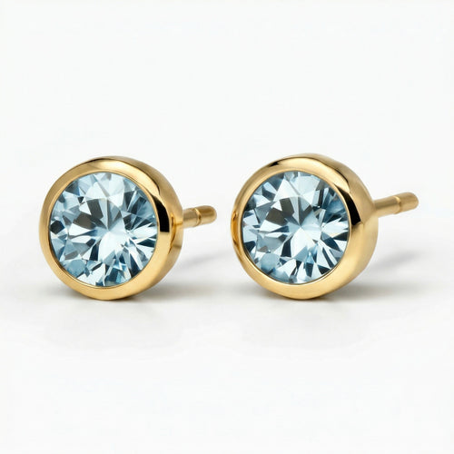 aquamarine birthstone stud earrings in yellow gold finish — side view