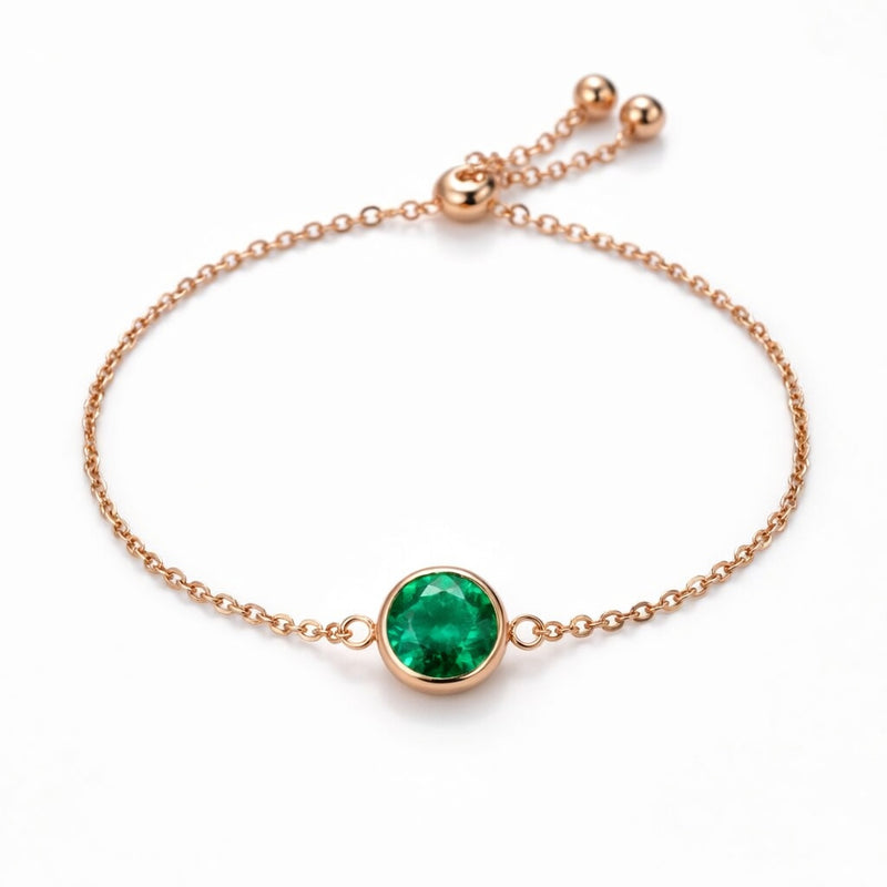 emerald birthstone bracelet in rose gold finish — front view