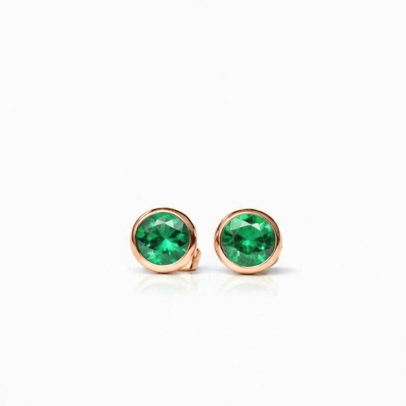 emerald birthstone stud earrings in rose gold finish — front view