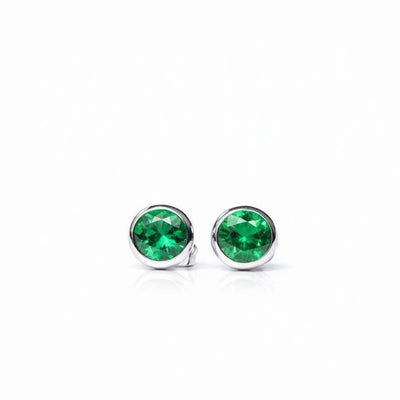 emerald birthstone stud earrings in white gold finish — front view