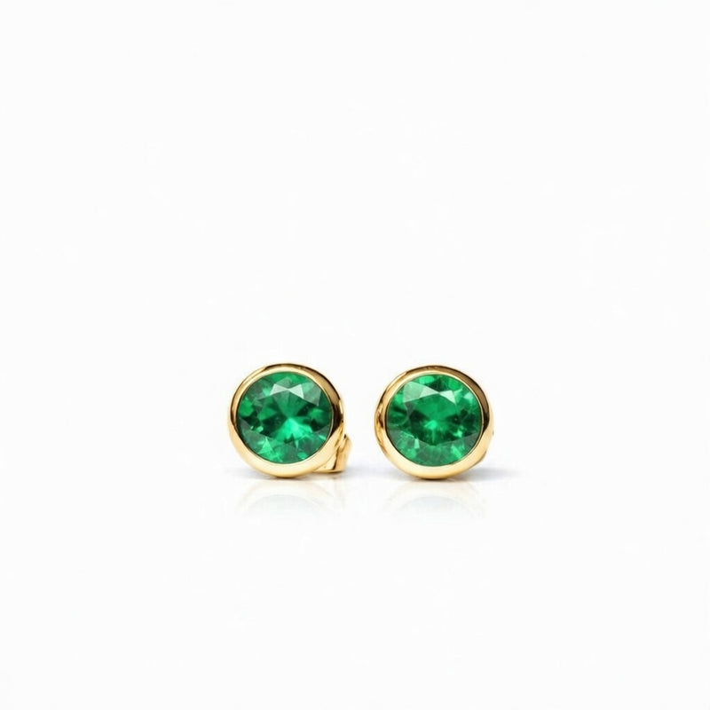 emerald birthstone stud earrings in yellow gold finish — front view