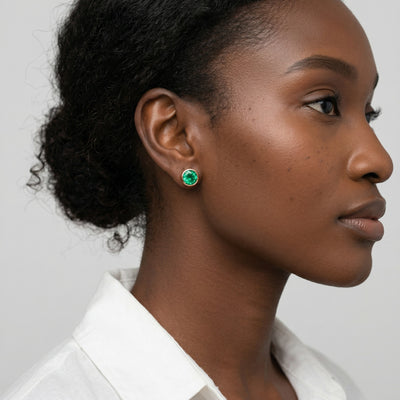 emerald birthstone stud earrings in rose gold finish — model view