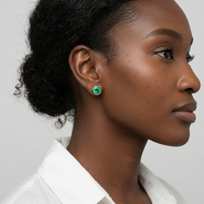 emerald birthstone stud earrings in rose gold finish — model view